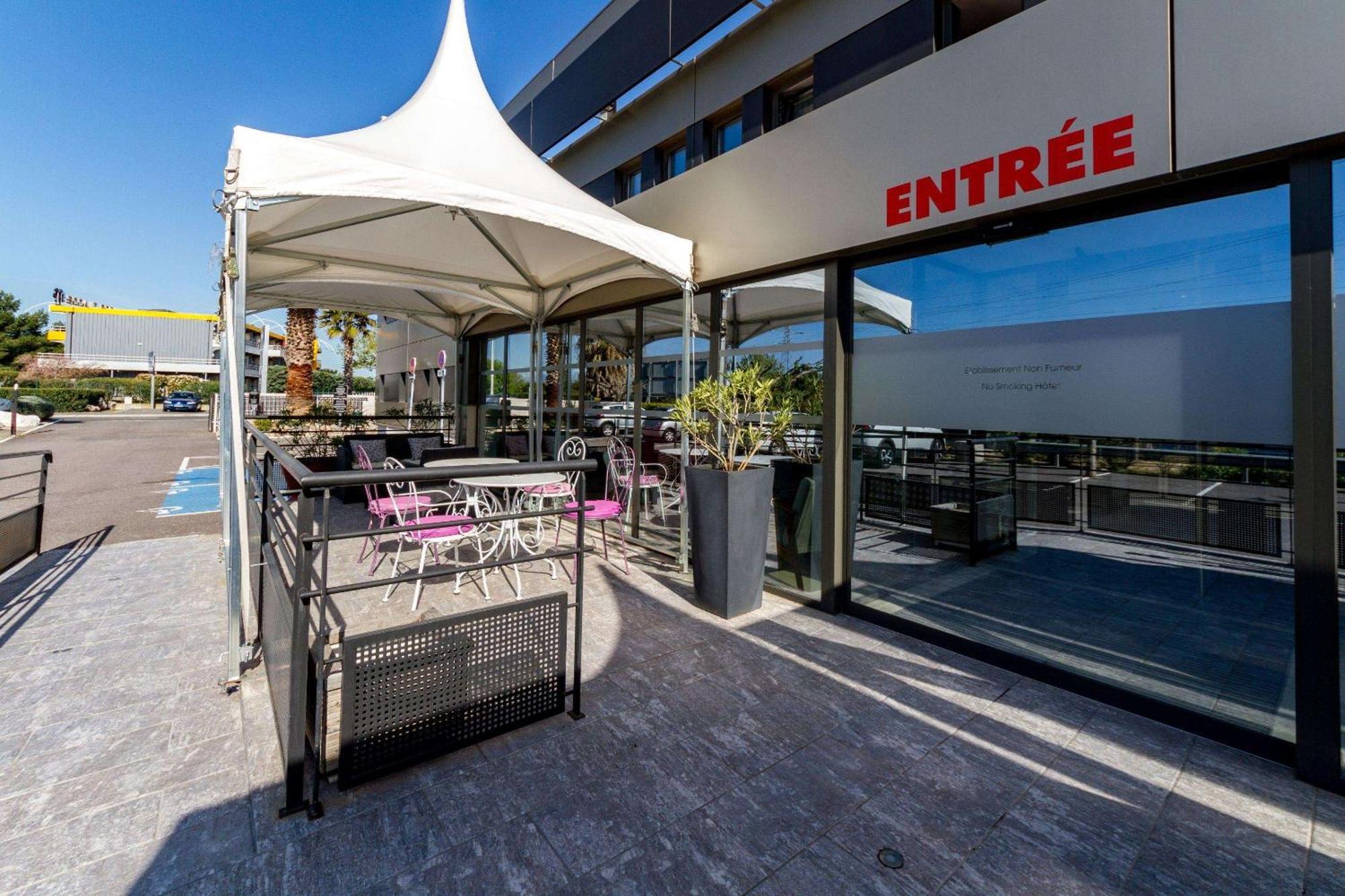 Brit Hotel Porte D'Espagne Perpignan Bagian luar foto
