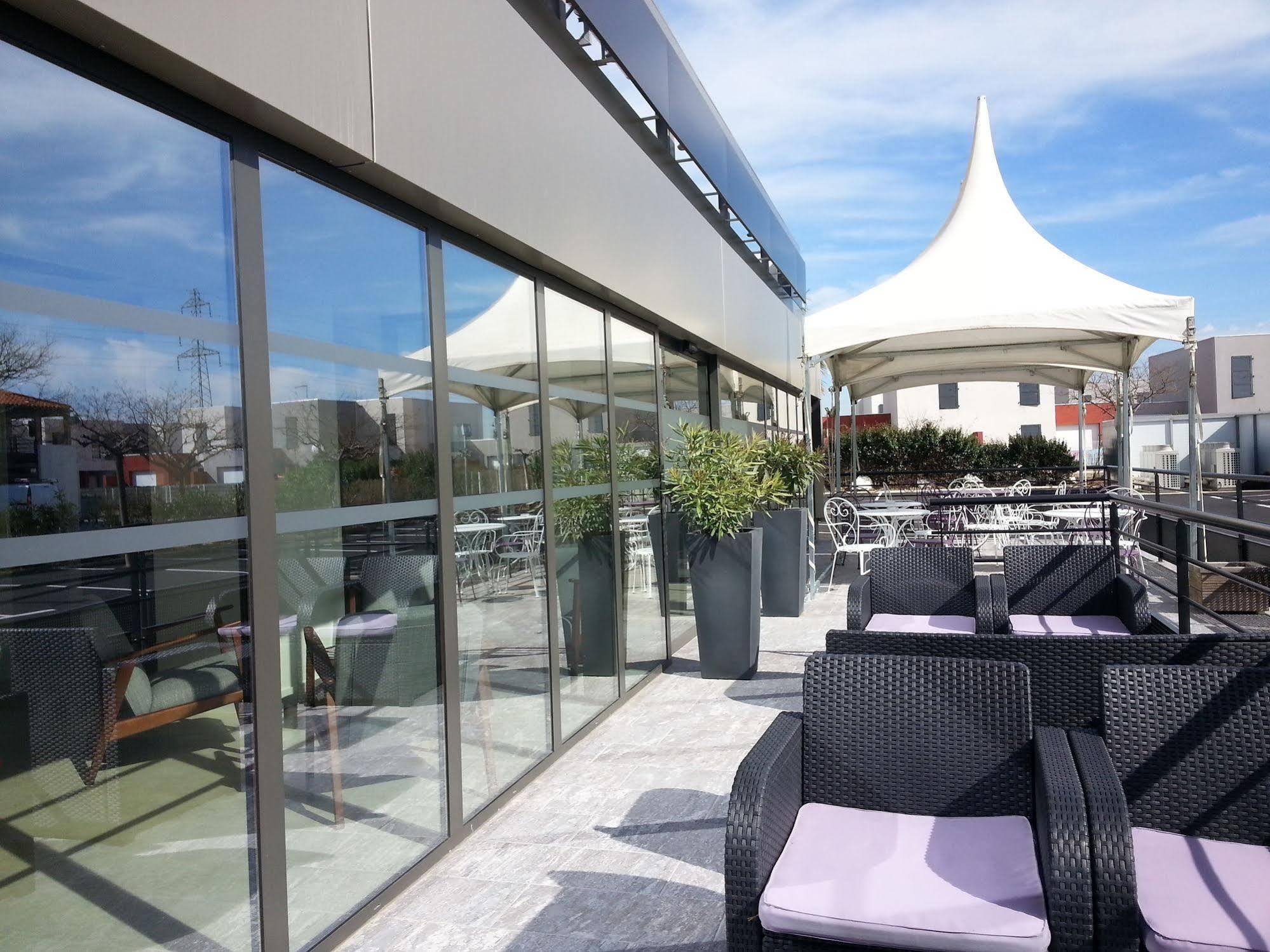 Brit Hotel Porte D'Espagne Perpignan Bagian luar foto